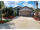 Charming single-story home with a two-car garage and beautifully landscaped front yard at 12634 Ringwood Ave, Orlando, FL 32837