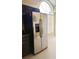 A stainless steel refrigerator with dark cabinets at 12634 Ringwood Ave, Orlando, FL 32837