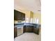 Spacious kitchen with dark cabinets, countertops, and stainless steel dishwasher at 12634 Ringwood Ave, Orlando, FL 32837