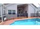 Screened-in pool with safety fence and outdoor living space, perfect for relaxing and entertaining at 12634 Ringwood Ave, Orlando, FL 32837