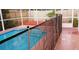 Swimming pool with dark black fence at 12634 Ringwood Ave, Orlando, FL 32837