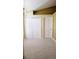 A room with white bi-fold closet doors and a white door at 12634 Ringwood Ave, Orlando, FL 32837