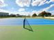 View of outdoor tennis courts with fenced perimeter and blue and green surface at 12634 Ringwood Ave, Orlando, FL 32837