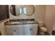 Bathroom features a large shower, double vanity, and decorative mirrors at 1313 Congo Dr, Kissimmee, FL 34759