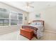 Charming bedroom with natural light, ceiling fan, and wood accents at 13258 Vennetta Way, Windermere, FL 34786