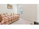 Bedroom featuring a daybed with a colorful plaid cover and natural light at 13258 Vennetta Way, Windermere, FL 34786