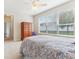 Bright Primary bedroom featuring a large window and a spacious layout at 13258 Vennetta Way, Windermere, FL 34786
