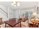 Open-concept living room with staircase and traditional-style furnishings at 13258 Vennetta Way, Windermere, FL 34786