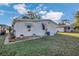 Exterior home view with well maintained lawn and flower beds at 145 Kensington Park Dr, Davenport, FL 33897