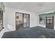 Sunroom featuring large windows, a ceiling fan, and carpeted floors, connecting the indoors with the outdoors at 145 Kensington Park Dr, Davenport, FL 33897