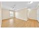 Bedroom with crown moulding, ceiling fan, wood flooring, and plenty of natural light at 1518 Orrington Payne Pl, Casselberry, FL 32707