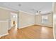 Bedroom with ensuite bathroom, wood floors, and a ceiling fan at 1518 Orrington Payne Pl, Casselberry, FL 32707