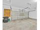 Spacious garage with garage door, trash receptacle, and overhead storage at 1518 Orrington Payne Pl, Casselberry, FL 32707
