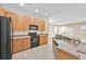 Well-equipped kitchen featuring modern appliances, ample cabinet space, granite countertops, and an open layout perfect for cooking at 1518 Orrington Payne Pl, Casselberry, FL 32707