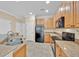 Functional kitchen with stainless steel appliances, granite countertops, ample cabinetry, and a practical layout for efficient cooking at 1518 Orrington Payne Pl, Casselberry, FL 32707