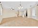 Open-concept living area featuring tile flooring, staircase, and view of the kitchen at 1518 Orrington Payne Pl, Casselberry, FL 32707