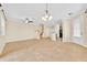 Spacious living room featuring tile floors, a staircase, and an open layout that flows into the kitchen at 1518 Orrington Payne Pl, Casselberry, FL 32707