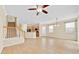 Spacious living area with open layout to the kitchen and staircase at 1518 Orrington Payne Pl, Casselberry, FL 32707