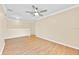 Upstairs loft featuring wood-look floors, neutral paint, and a ceiling fan at 1518 Orrington Payne Pl, Casselberry, FL 32707