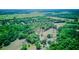 Expansive aerial view of the property, showcasing lush greenery and rolling fields at 15345 Rockridge Rd, Polk City, FL 33868