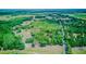 Breathtaking aerial view of lush green land, showcasing the expansive property and serene surroundings at 15345 Rockridge Rd, Polk City, FL 33868