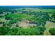 Expansive aerial view featuring lush green land, highlighting the vastness of the property at 15345 Rockridge Rd, Polk City, FL 33868