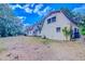 Spacious backyard view showcasing the home and natural surroundings at 15345 Rockridge Rd, Polk City, FL 33868