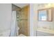 Modern bathroom features a tiled shower, contemporary vanity, and ample lighting at 15345 Rockridge Rd, Polk City, FL 33868