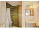 Tiled shower area with modern vanity, basin sink, and contemporary fixtures at 15345 Rockridge Rd, Polk City, FL 33868