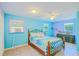 Inviting bedroom with wood-look flooring, a large dresser, and comfortable decor at 15345 Rockridge Rd, Polk City, FL 33868