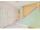 Bright foyer features a unique staircase and a decorative front door with glass detail at 15345 Rockridge Rd, Polk City, FL 33868