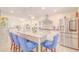 Spacious kitchen showcases an island with seating, stainless steel appliances, and stylish accents at 15345 Rockridge Rd, Polk City, FL 33868