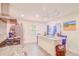 Large kitchen offers a center island with seating, stainless steel appliances, and modern finishes at 15345 Rockridge Rd, Polk City, FL 33868
