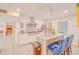 This spacious kitchen boasts stainless steel appliances, a center island with seating, and ample counter space at 15345 Rockridge Rd, Polk City, FL 33868