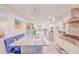 Bright, open kitchen features a large island with seating, modern appliances, and stylish finishes at 15345 Rockridge Rd, Polk City, FL 33868