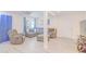 Comfortable living room boasts new flooring and a large, gray sectional couch at 15345 Rockridge Rd, Polk City, FL 33868