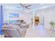 Inviting living room features a gray sectional couch and light-colored flooring at 15345 Rockridge Rd, Polk City, FL 33868