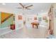 Spacious living room with a pool table, brick fireplace, and new flooring at 15345 Rockridge Rd, Polk City, FL 33868