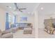 Bright living room showcases light-colored flooring and a cozy, gray sectional couch at 15345 Rockridge Rd, Polk City, FL 33868