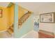 A vibrant stairway with contrasting yellow and green walls leads to the upper level of the home at 15345 Rockridge Rd, Polk City, FL 33868