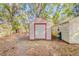 Outdoor storage sheds with red trim, offering convenient space for tools and equipment at 15345 Rockridge Rd, Polk City, FL 33868