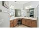 Bright bathroom featuring vanity with double sinks, ample counterspace and large mirror at 159 Ventana Dr, Kissimmee, FL 34759