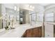 Bathroom vanity with sink, large mirror, and adjacent glass shower at 159 Ventana Dr, Kissimmee, FL 34759