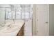 Bathroom vanity with white countertop and a glass-enclosed shower at 159 Ventana Dr, Kissimmee, FL 34759