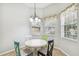 Cozy dining area with tiled flooring and natural light from large windows at 159 Ventana Dr, Kissimmee, FL 34759