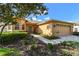 Attractive single-story home with manicured landscaping and a brick-paved walkway leading to the front door at 159 Ventana Dr, Kissimmee, FL 34759