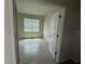 Well-lit bedroom has window with blinds and neutral-toned floor tiling at 1892 Spring Shower Cir, Kissimmee, FL 34744
