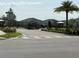 Inviting gated community entrance with lush landscaping, enhancing curb appeal at 1892 Spring Shower Cir, Kissimmee, FL 34744