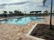 Sparkling community pool featuring a spacious sundeck and comfortable lounge chairs at 1892 Spring Shower Cir, Kissimmee, FL 34744