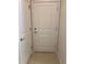 A hallway with access to a bedroom and a bathroom at 1892 Spring Shower Cir, Kissimmee, FL 34744